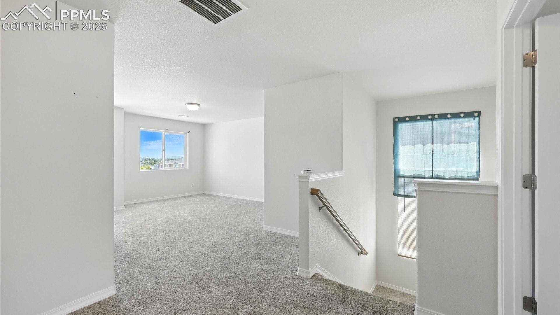 Upper Level Loft provides flexible living space, ideal as a 2nd living area, game room, or study. 