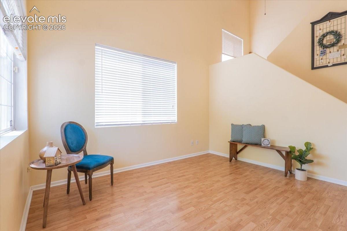 Vaulted ceilings, option to use as formal living or dining, or a home office. Long decorative planter shelf above on the right side