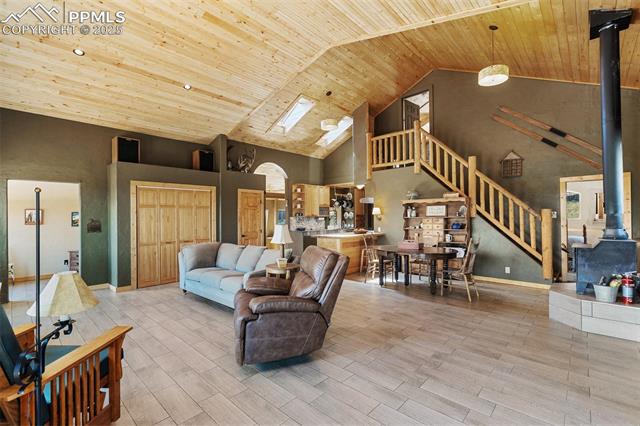 Great room brings the living, dining, and kitchen space into an open and airy living space with natural light and unobscured views. 