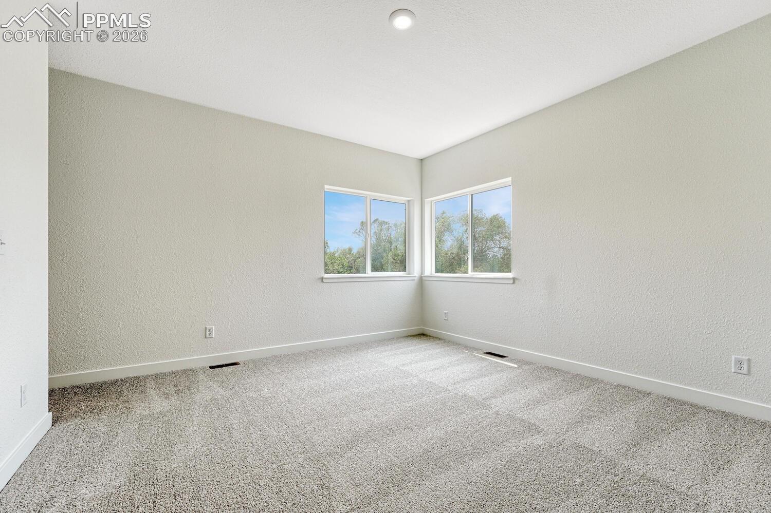 9 ft ceilings on the upper level. Primary bedroom glows with natural light.
