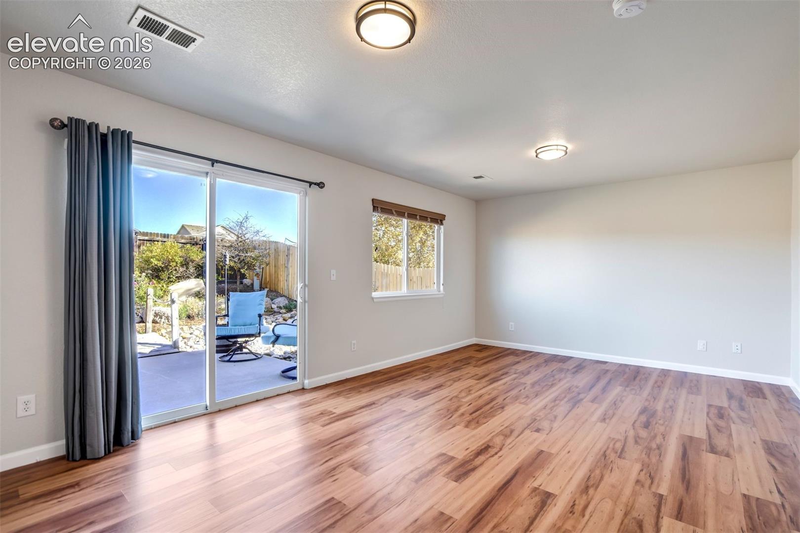 Family room walks out to the private backyard. 