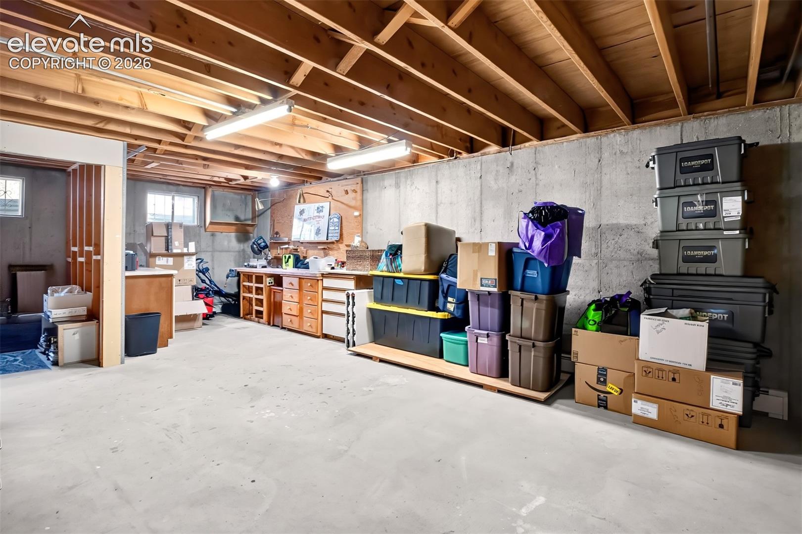 A workbench and cabinets, a rough in 5th bath area-potential galore!