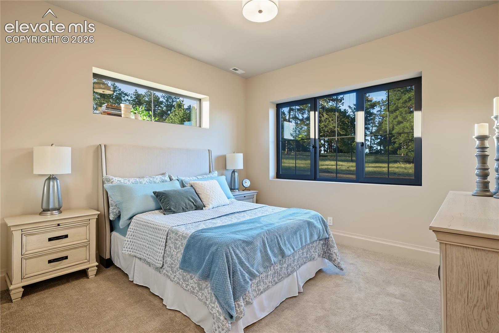 Fourth bedroom with amazing views out into the trees, basement