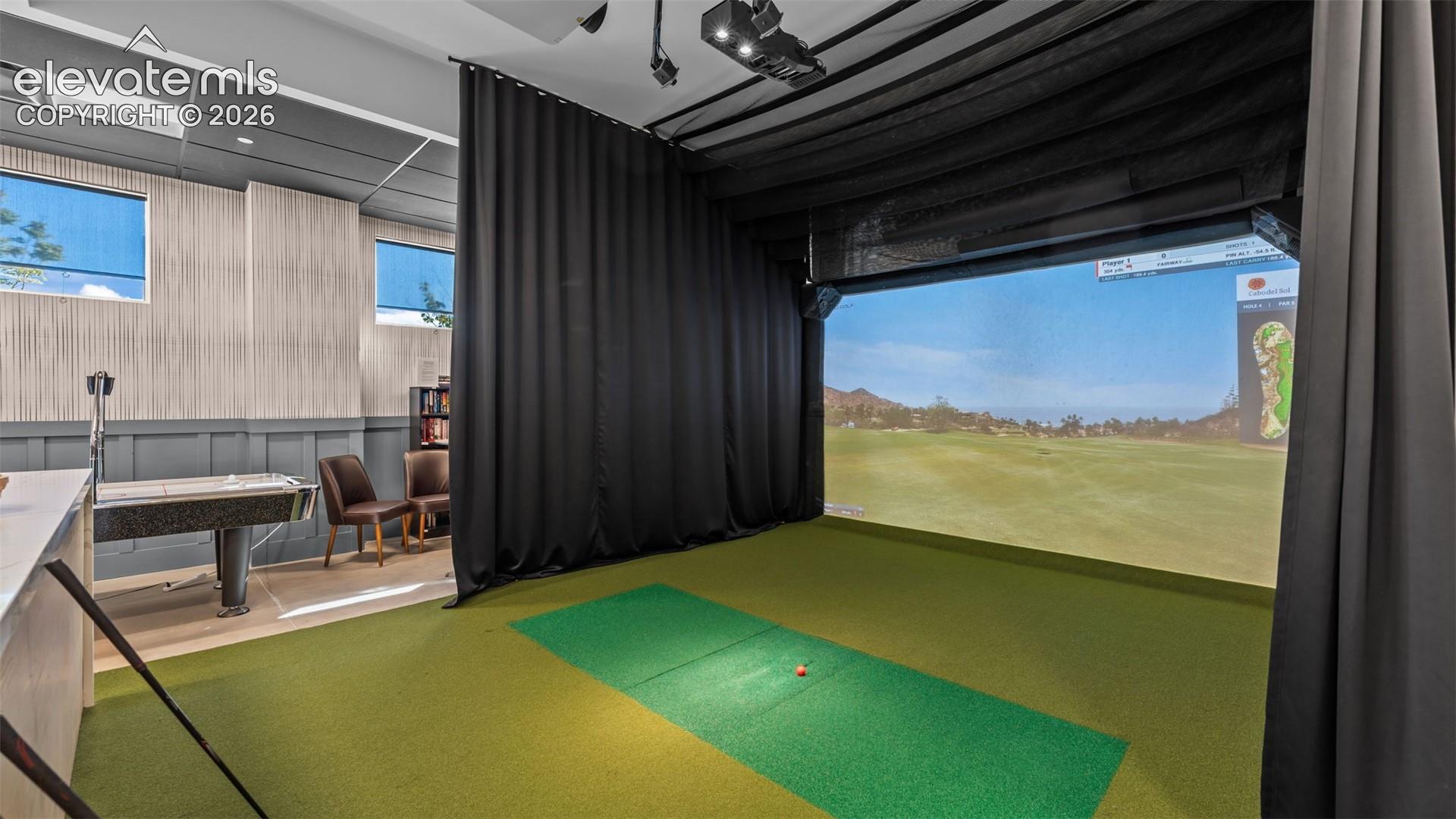 Golf simulator in the community clubhouse. 