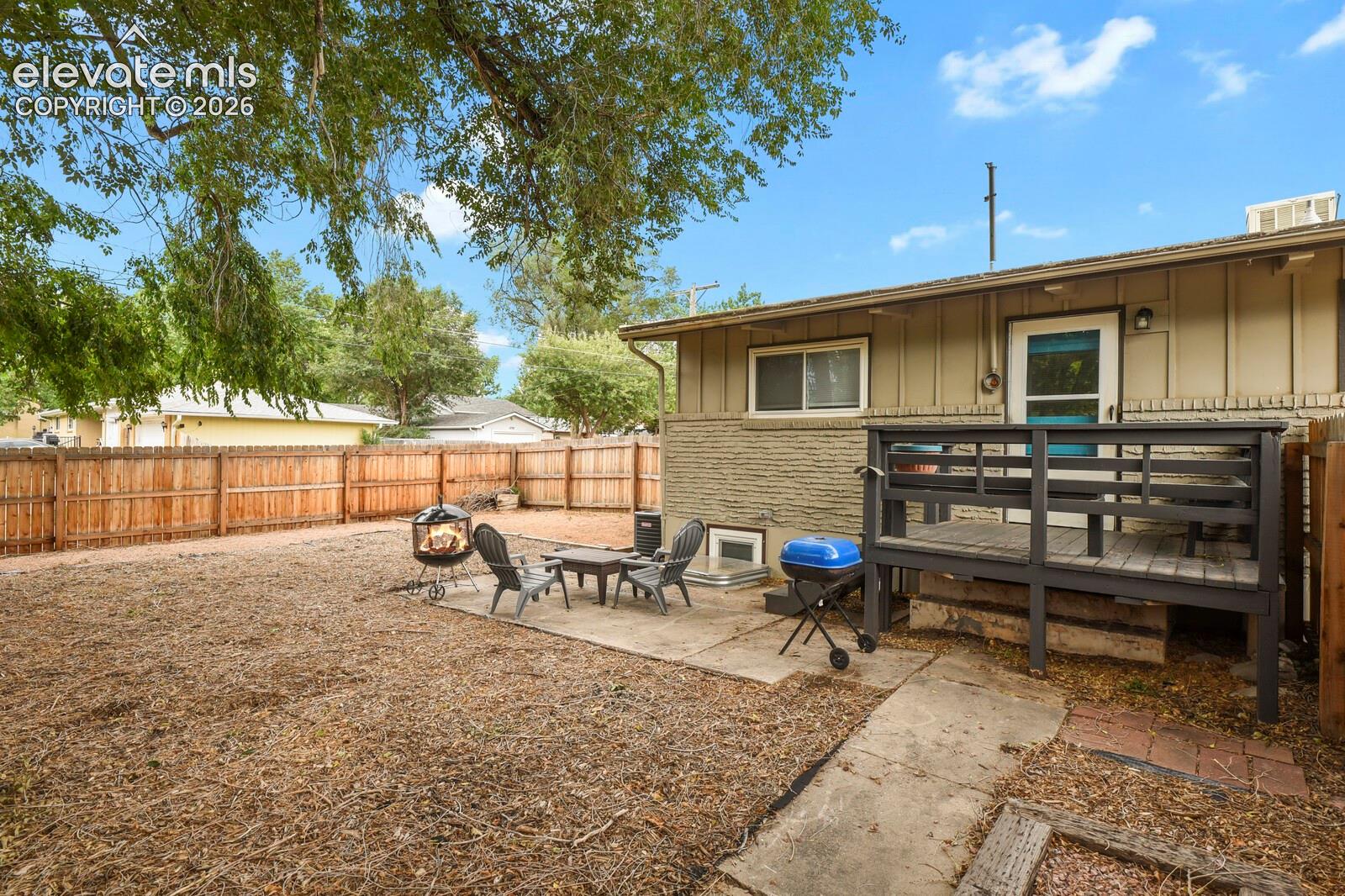 Picture of backyard from the front corner of the fence.