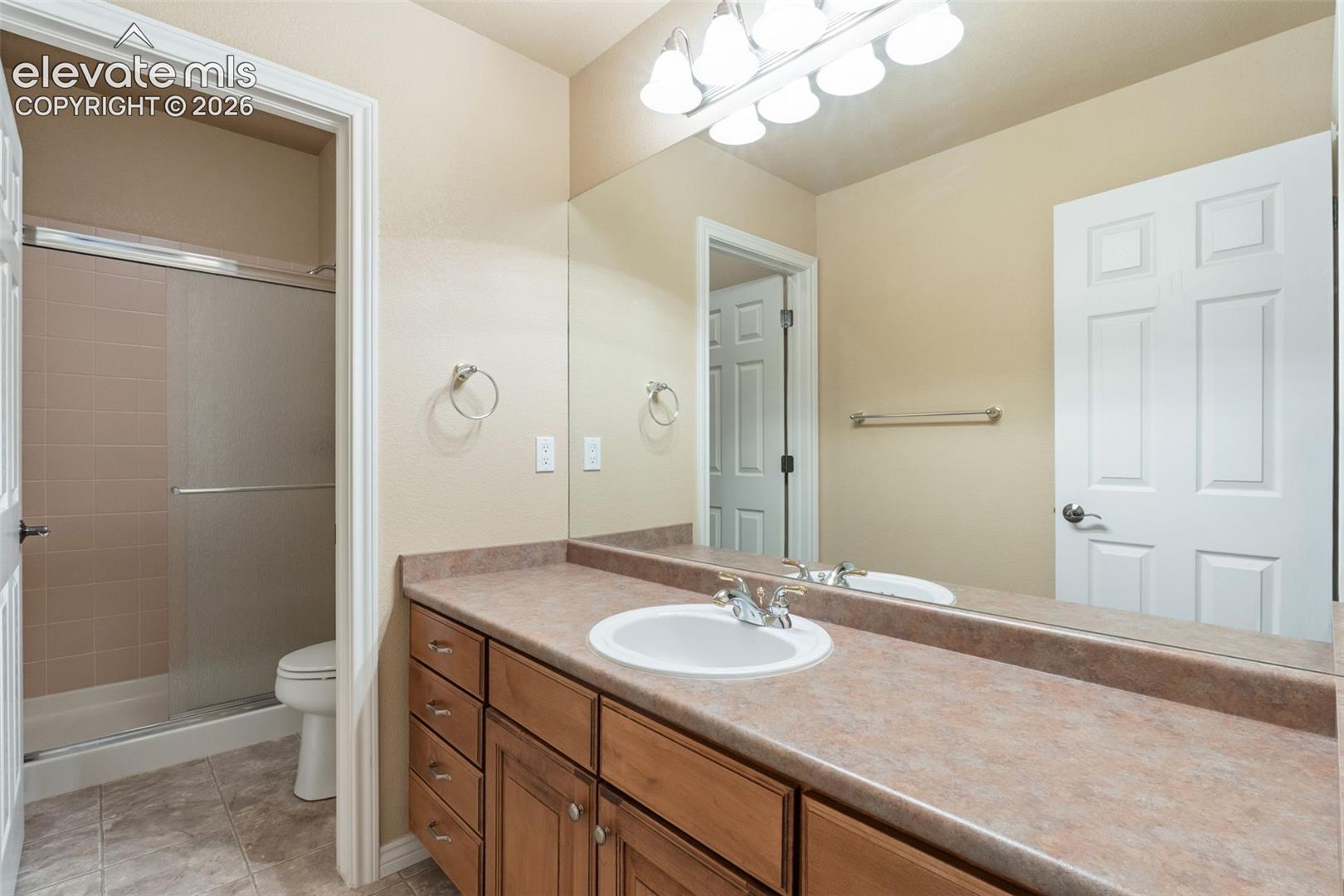 FULL BATHROOM IN BASEMENT WITH DOOR TO TOILET & SHOWER