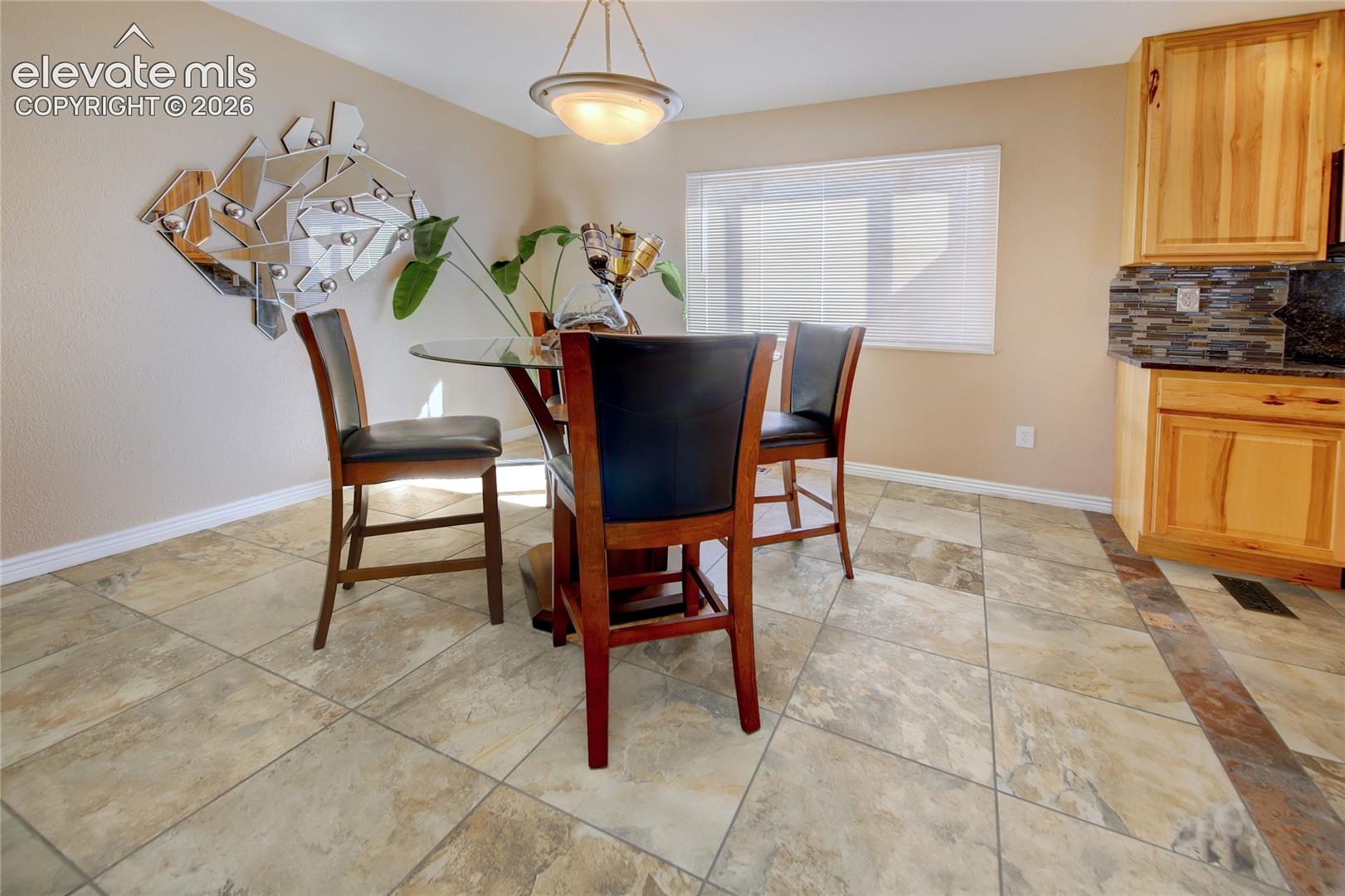 large dining area with custom tile.