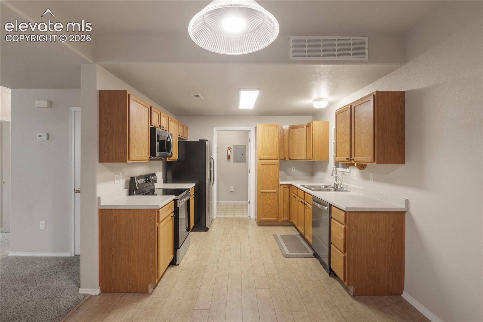 Straight shot of Kitchen from Dining Area