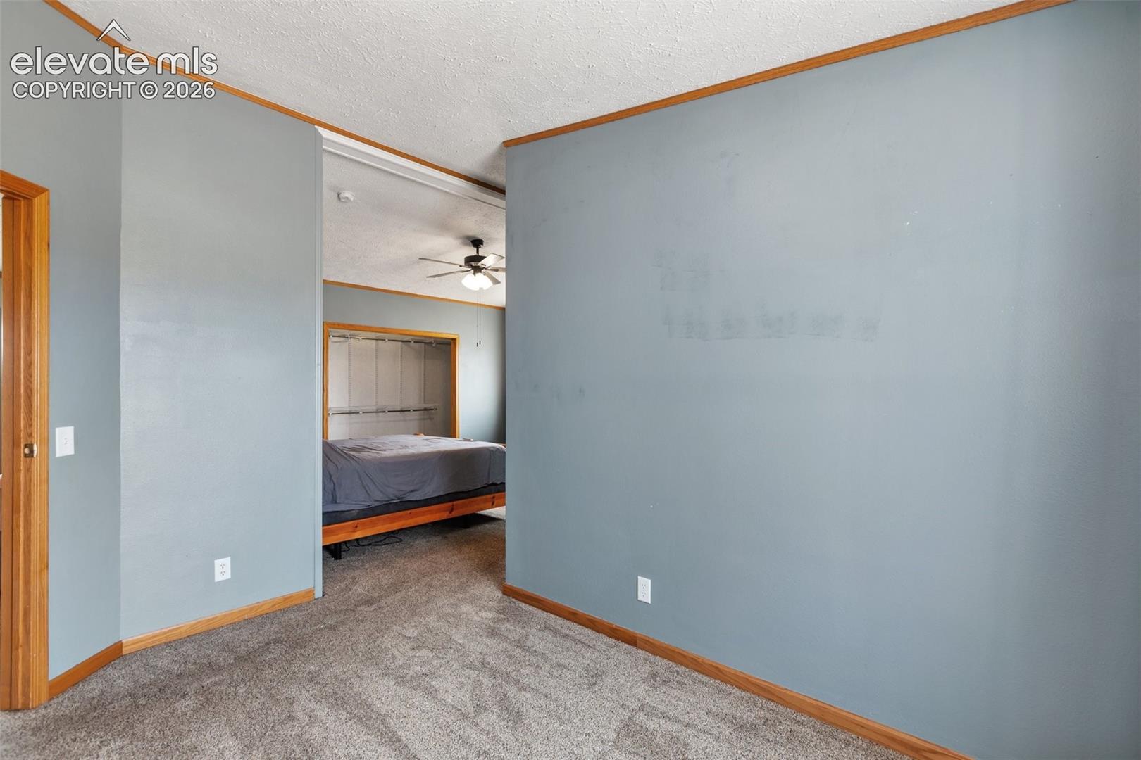 Primary sitting area within primary bdrm