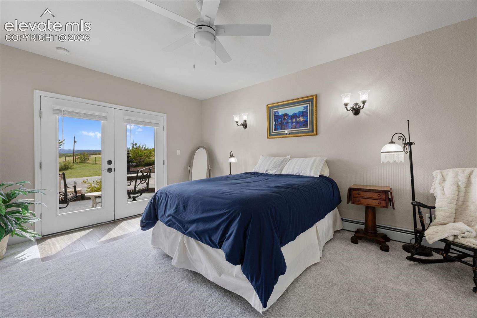 Guest suite with double-door entry, private patio access, and large walk-in closet. 