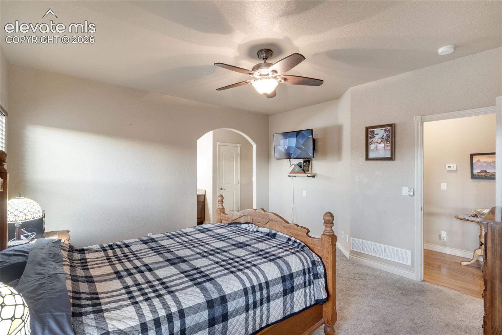 Primary Bedroom with attached bathroom and walk in closet