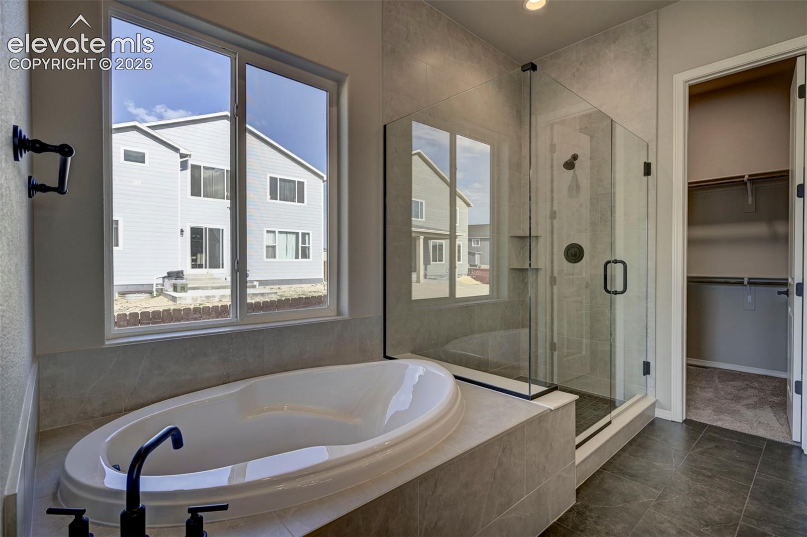 soaking tub and Euro glass shower