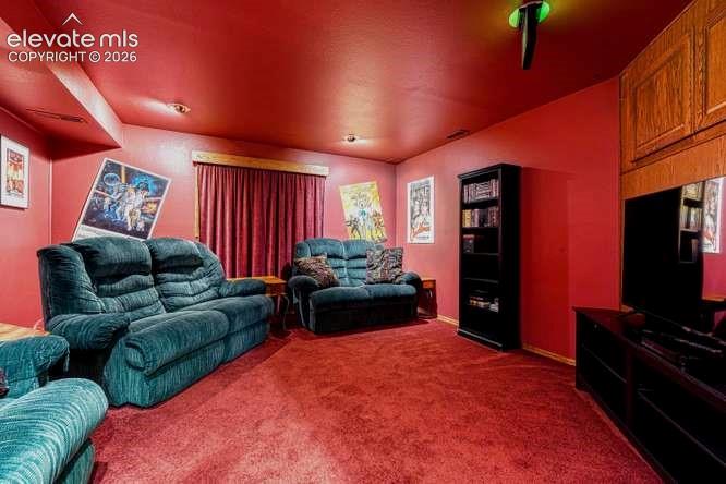 Theater room in basement. TV, chairs, speakers included.