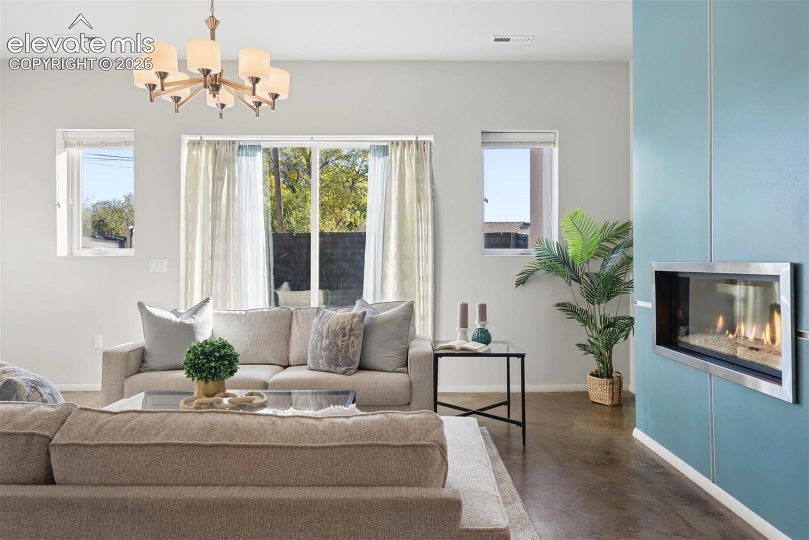 Living room with walkout and fireplace