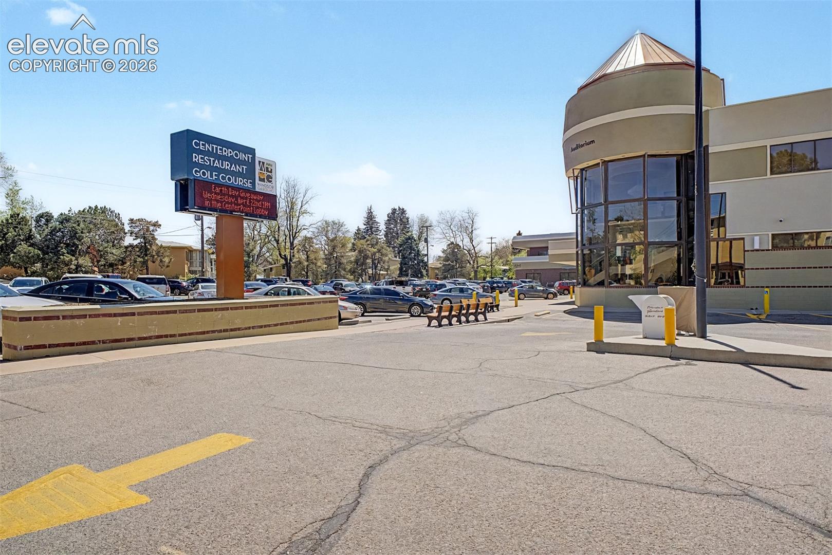 Large surface parking lot with a prominent signage display