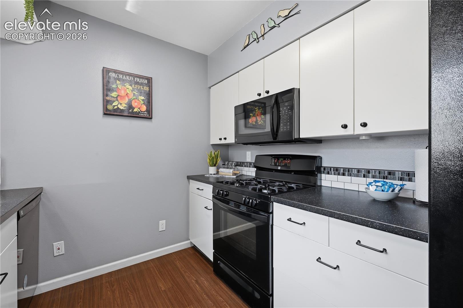 Updated kitchen with crisp cabinetry, sleek finishes, and a fresh, modern feel that makes meal prep simple and stylish.