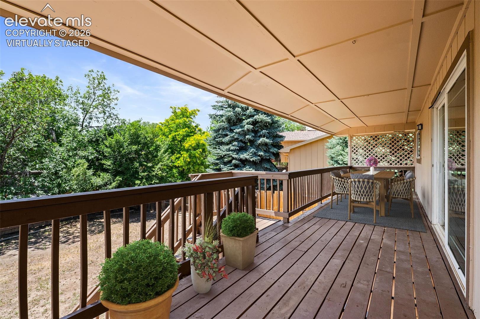 Virtually Staged; Upper Covered Deck Off of Kitchen & Den