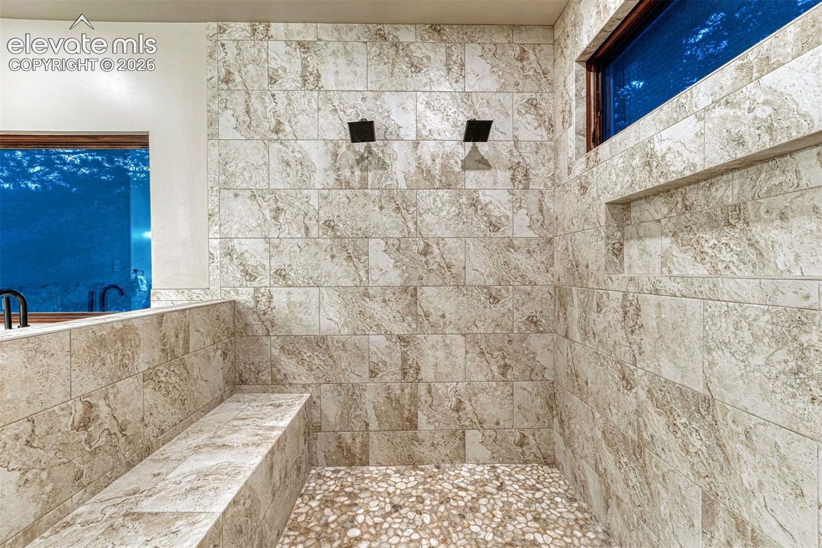 Walk in shower with four shower heads
