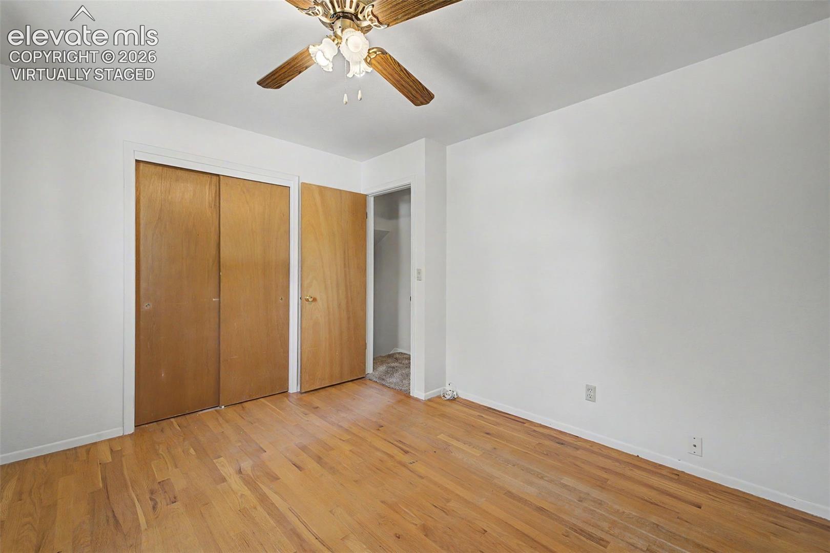Virtually Staged with flooring - wood flooring under carpet