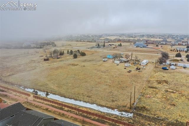 Aerial view of property's location featuring rural landscape