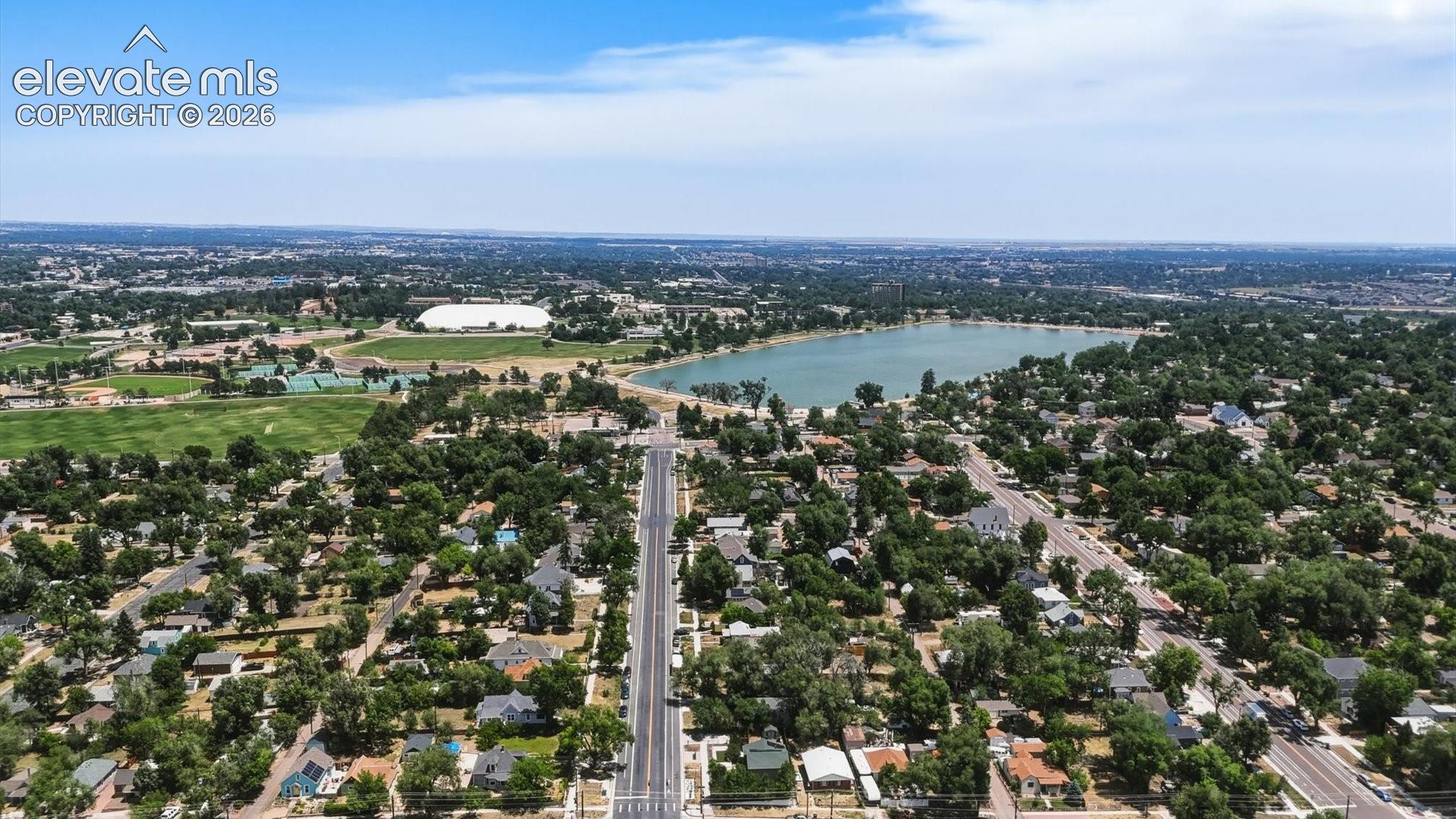 Aerial view of Memorial Park and Prospect Lake that provides trails, sports fields, an indoor pool, ice rink, fitness programs, and more.