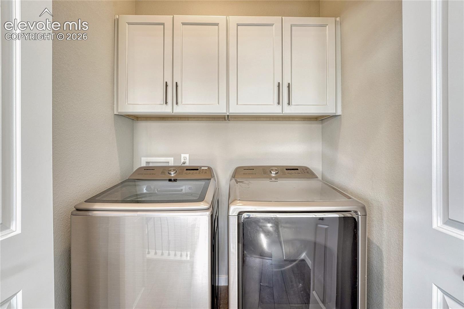 Upper level laundry space with cabinetry...washer and dryer included!