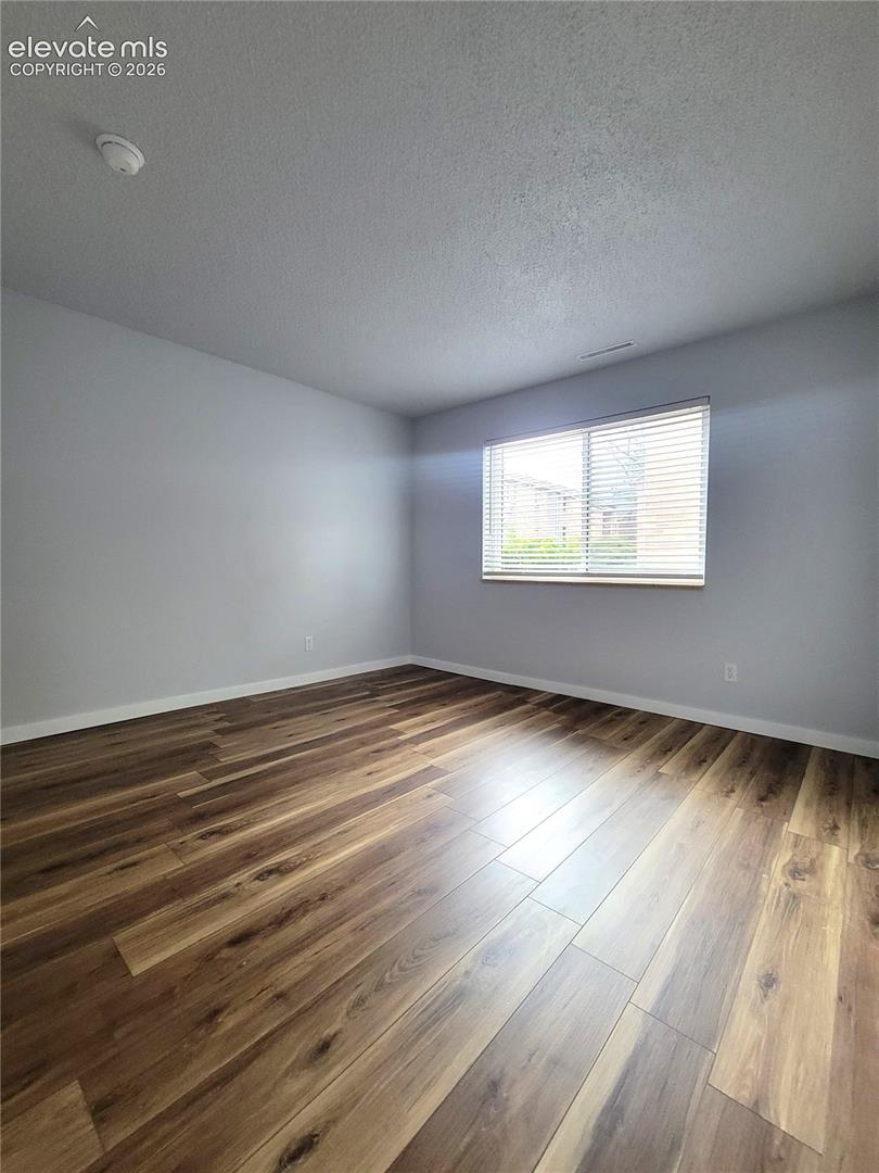 Spacious secondary bedroom featuring walk-in closet