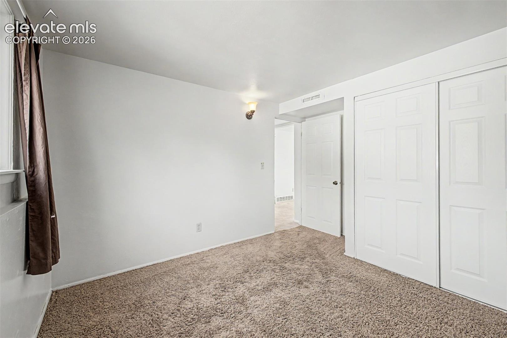 Lower level bedroom makes for a perfect office or guest room. 