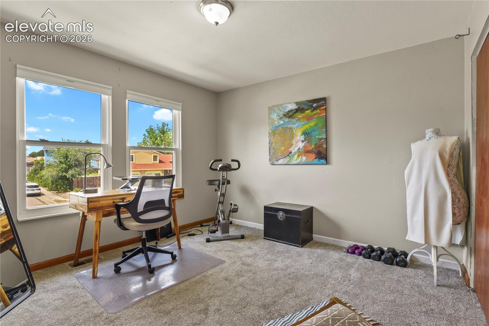 Upper level bedroom currently used as office