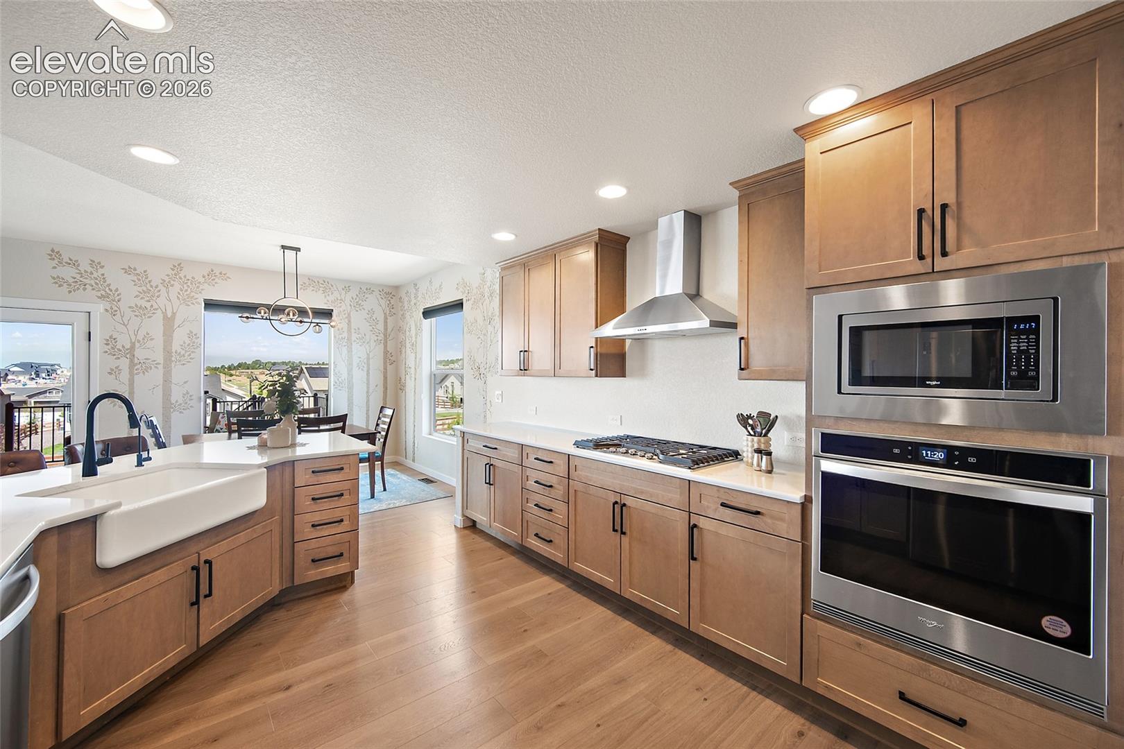Light wood-finish flooring with recessed lighting