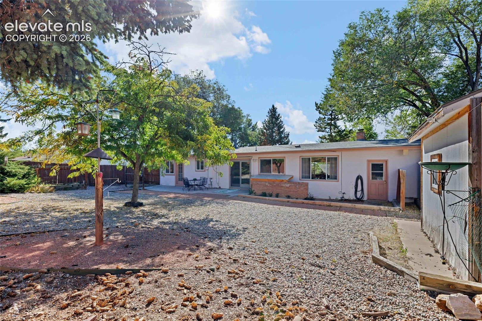 Large yard has storage shed & alley access to park RV in the yard