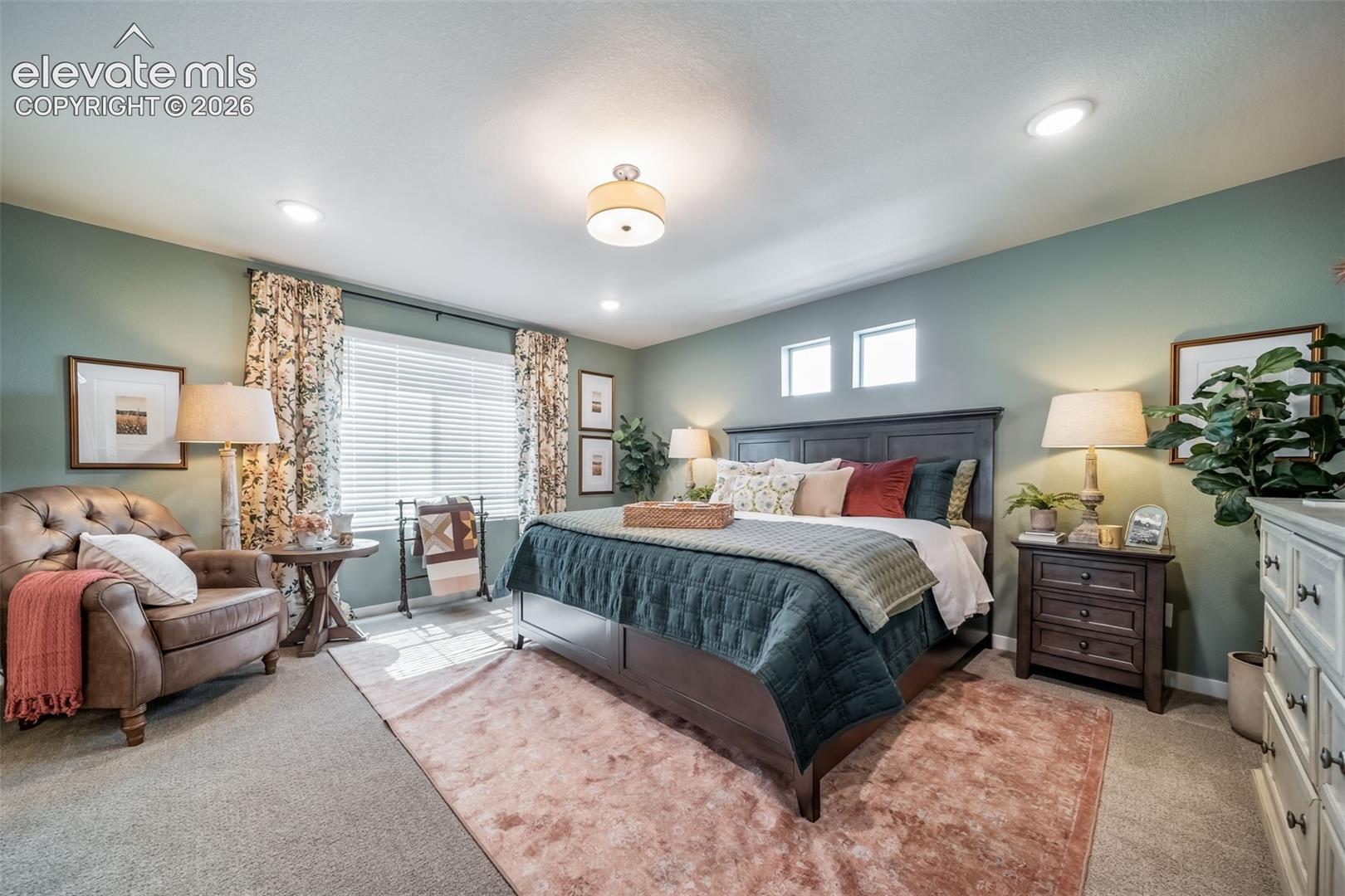 Carpeted room featuring recessed lighting, a ceiling-mounted light fixture, and multiple windows
*Photos of a model home*