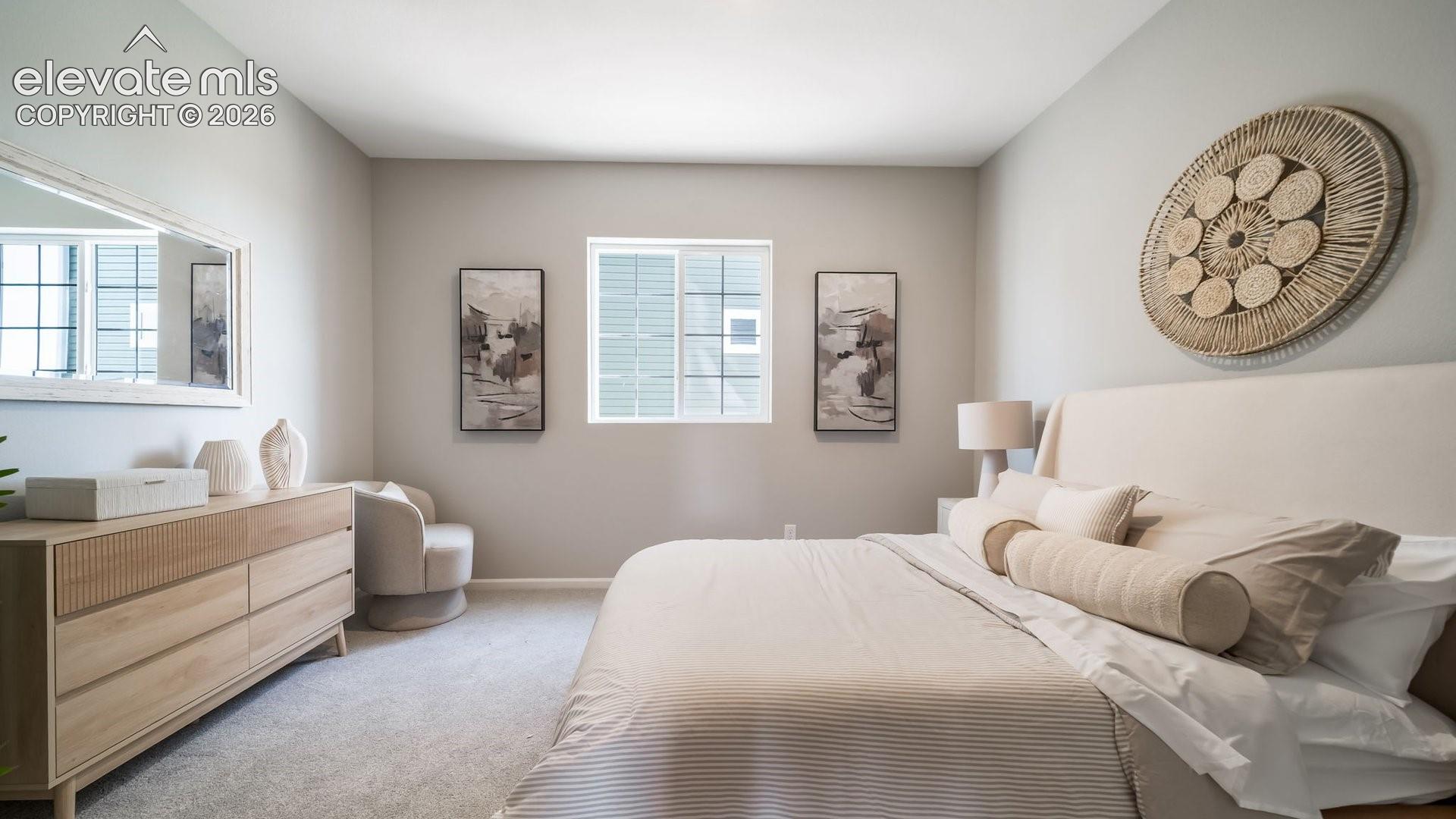 Carpeted flooring, neutral wall tones, and a window with blinds
*photos of a model home*