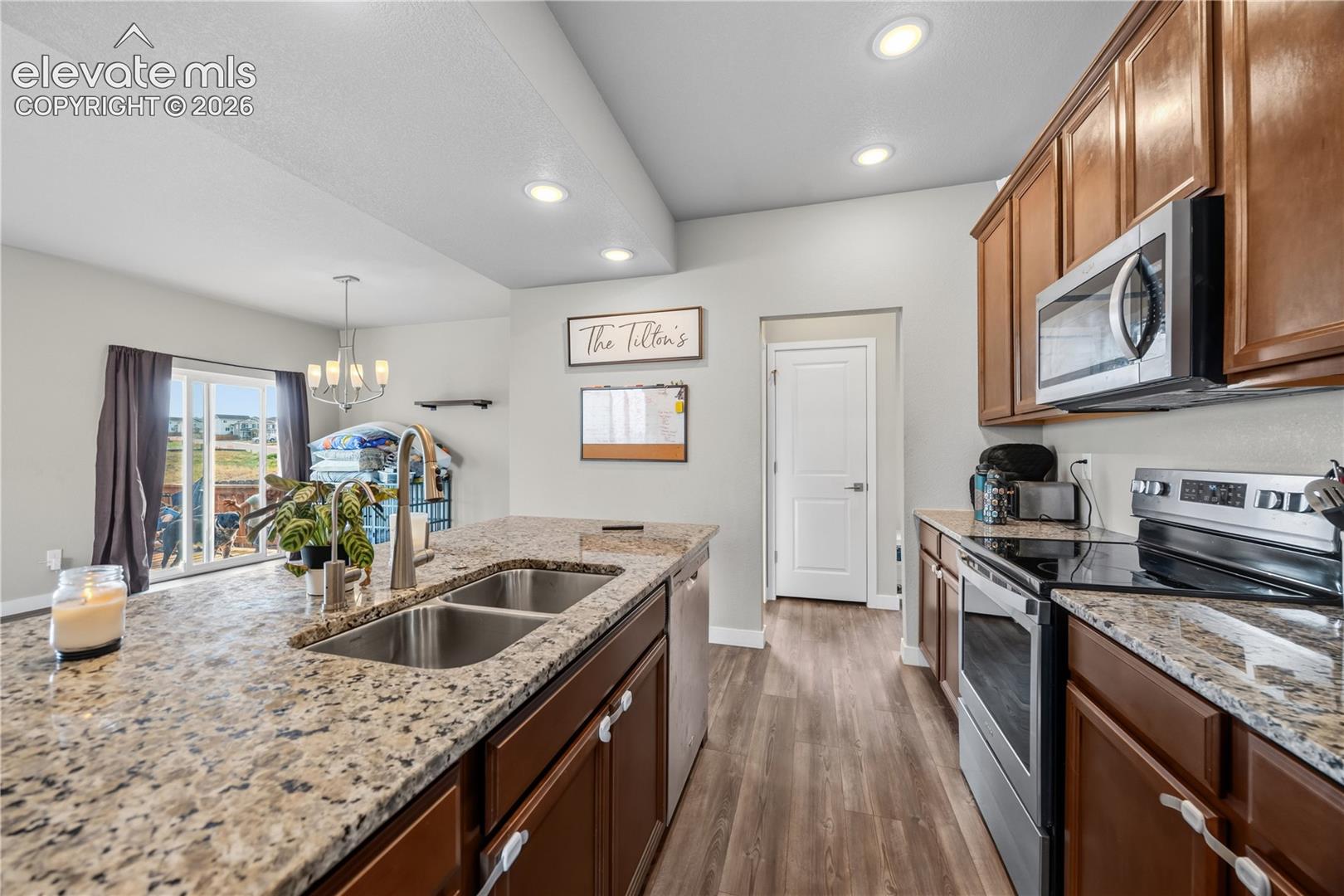 View from the Kitchen into the Mud Room with garage access and the main level Powder Room.