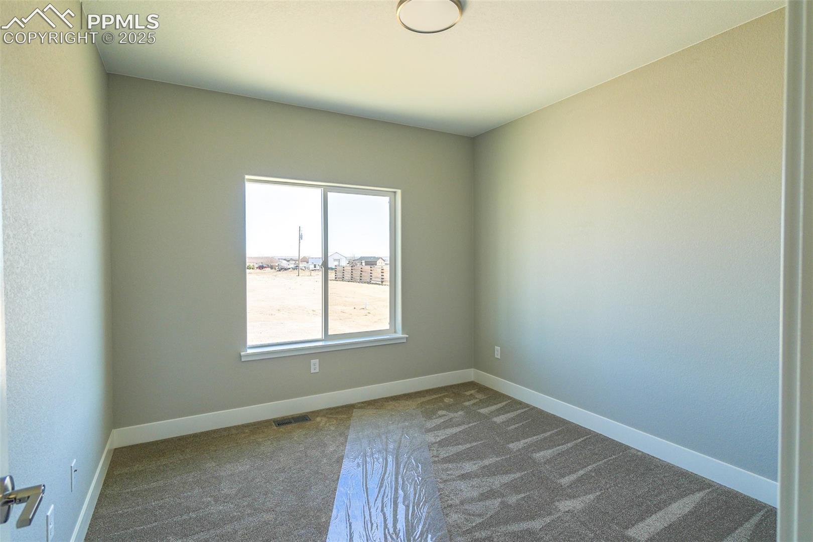 #3 Bedroom featuring carpet floors