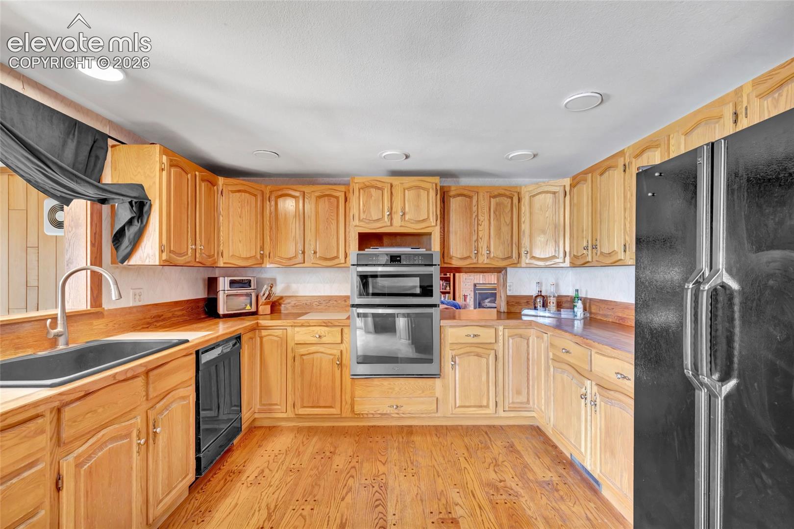 Wood-finish flooring with extensive wood cabinetry