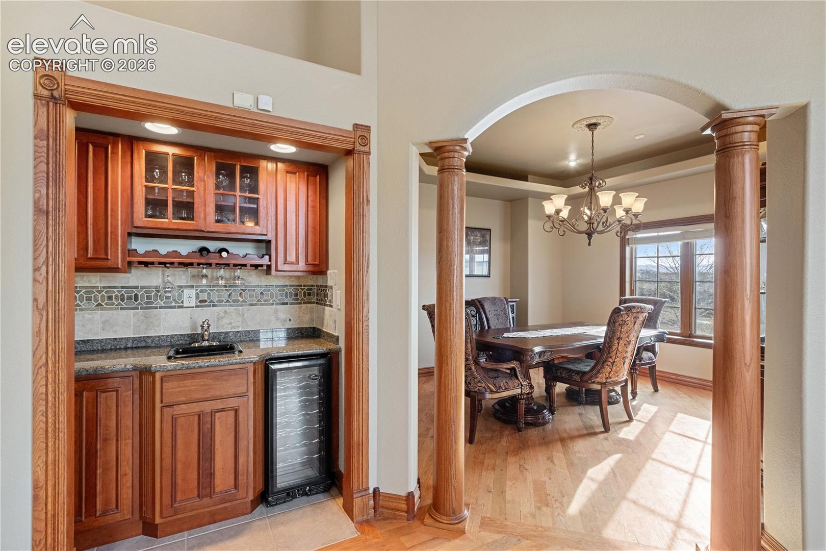 Wet bar in living room, looking into dining room