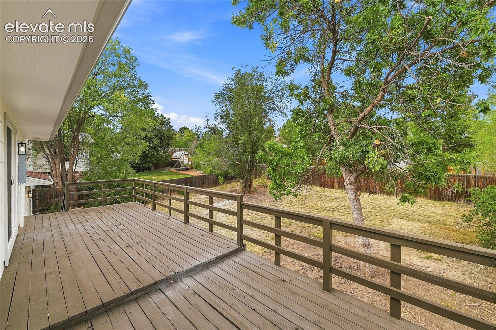 Expansive wood deck with a perimeter railing