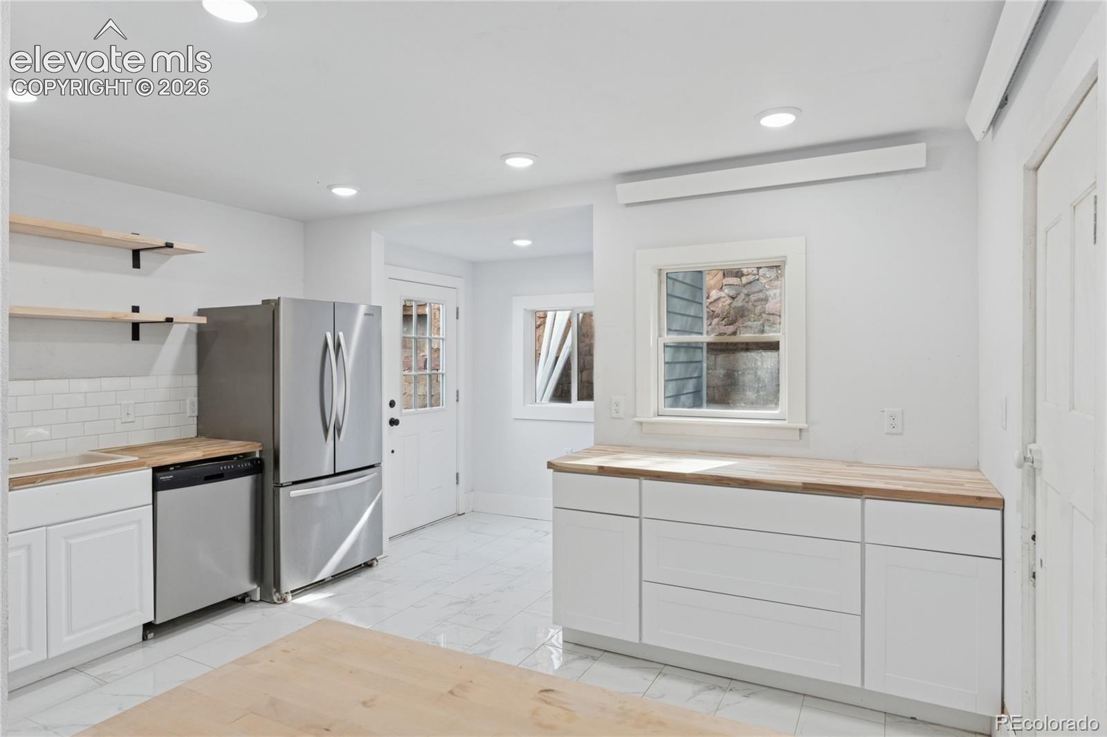 Main-level flat kitchen
with door to rear area
of the property