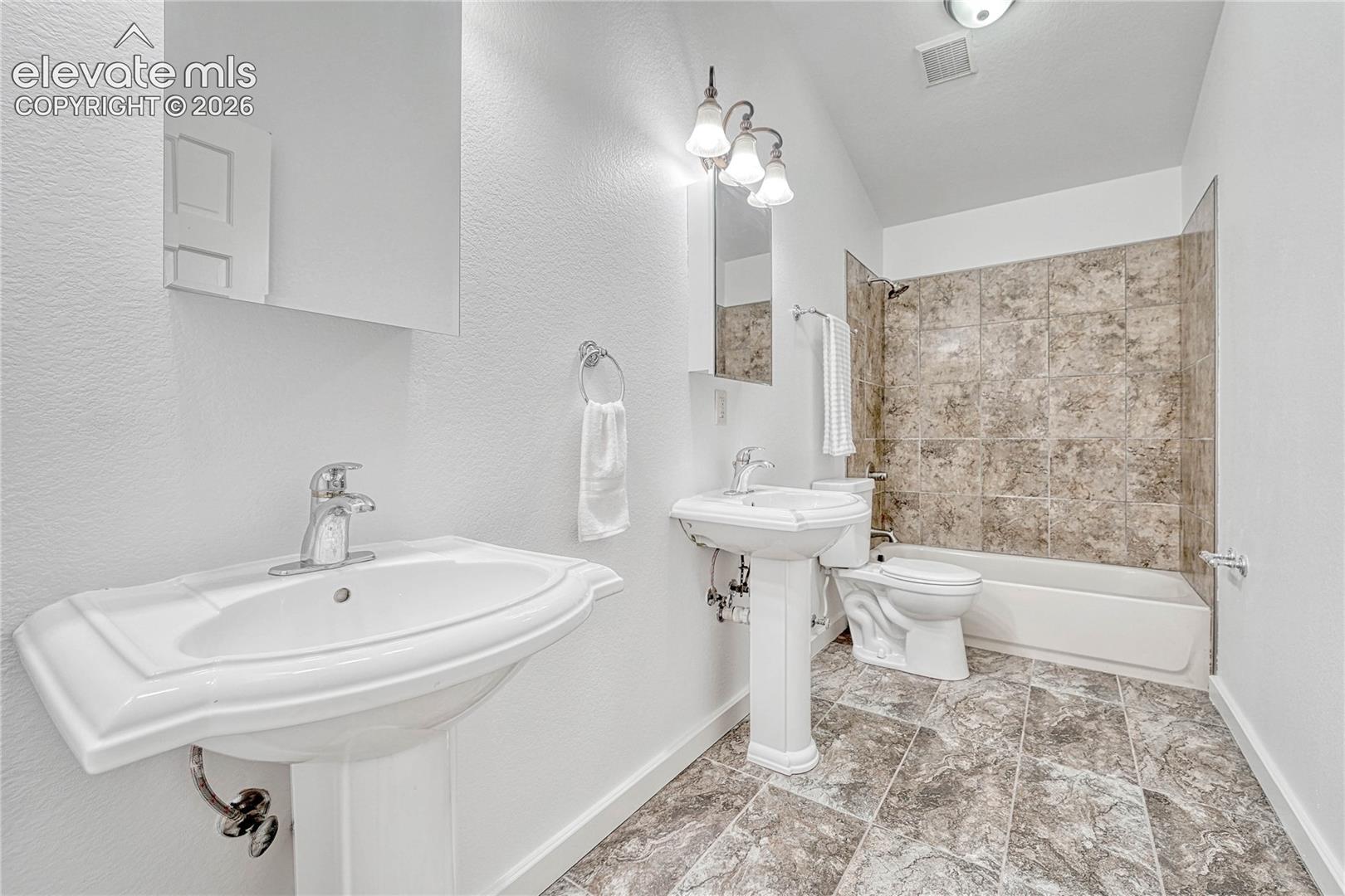 2nd Upper Full bathroom, double Pedestal Sink, lofted ceiling,