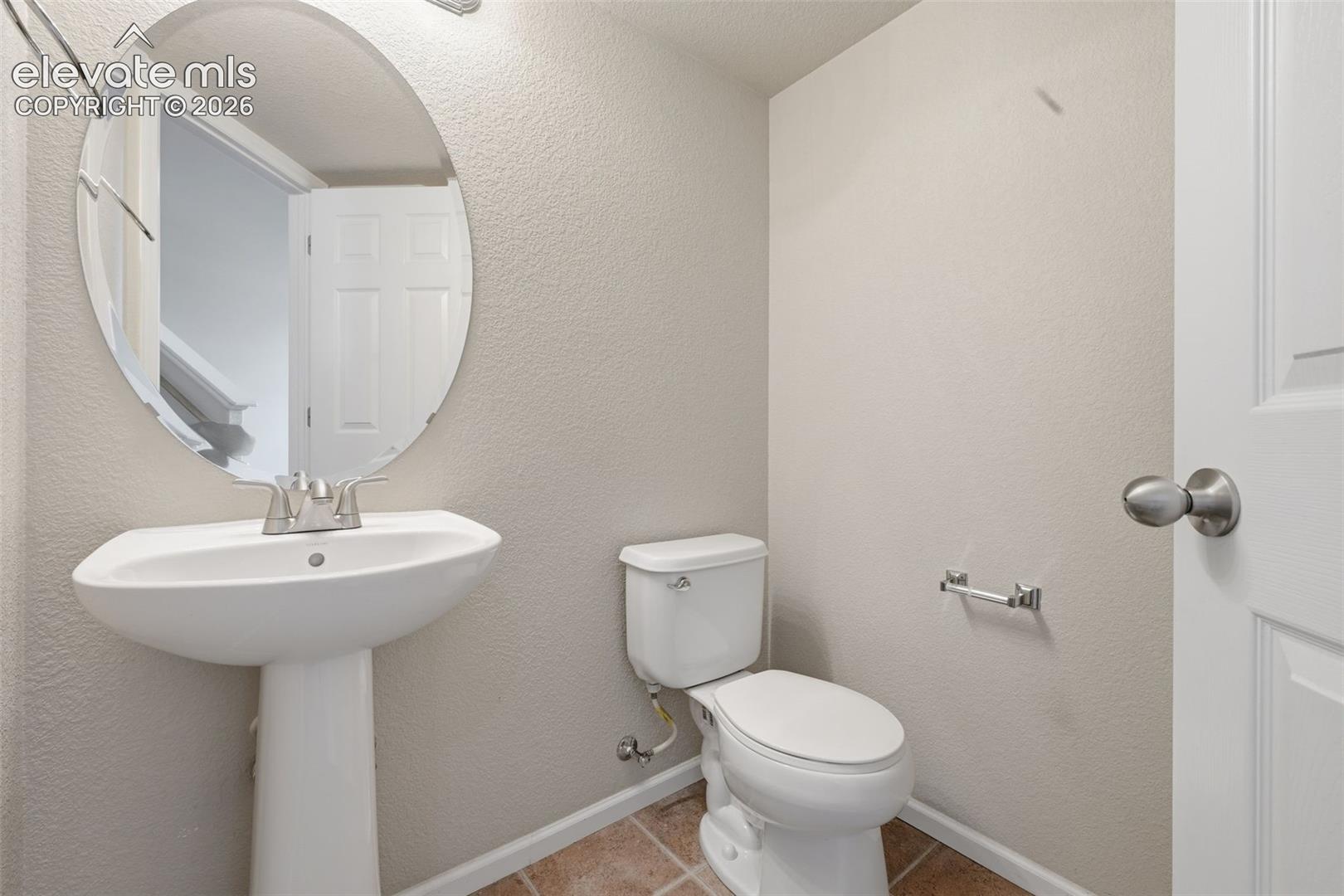 Main level half bathroom. 