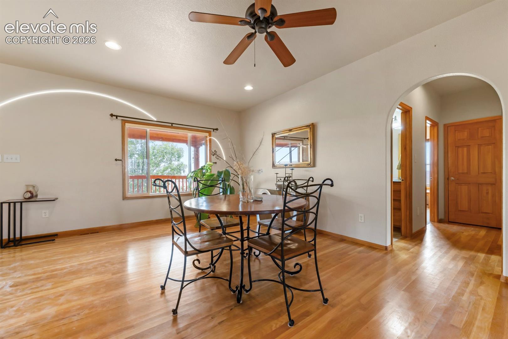 Home is light and bright on the main level.  Through the arch are 2 bedrooms and secondary main floor bath.