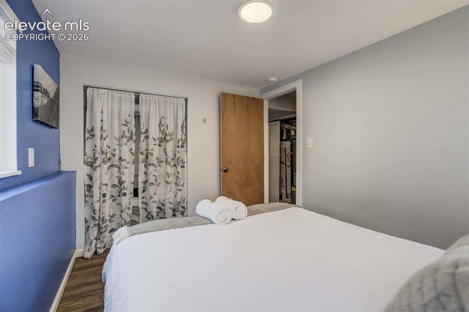 Recessed lighting, wood-finish flooring, and a solid core interior door