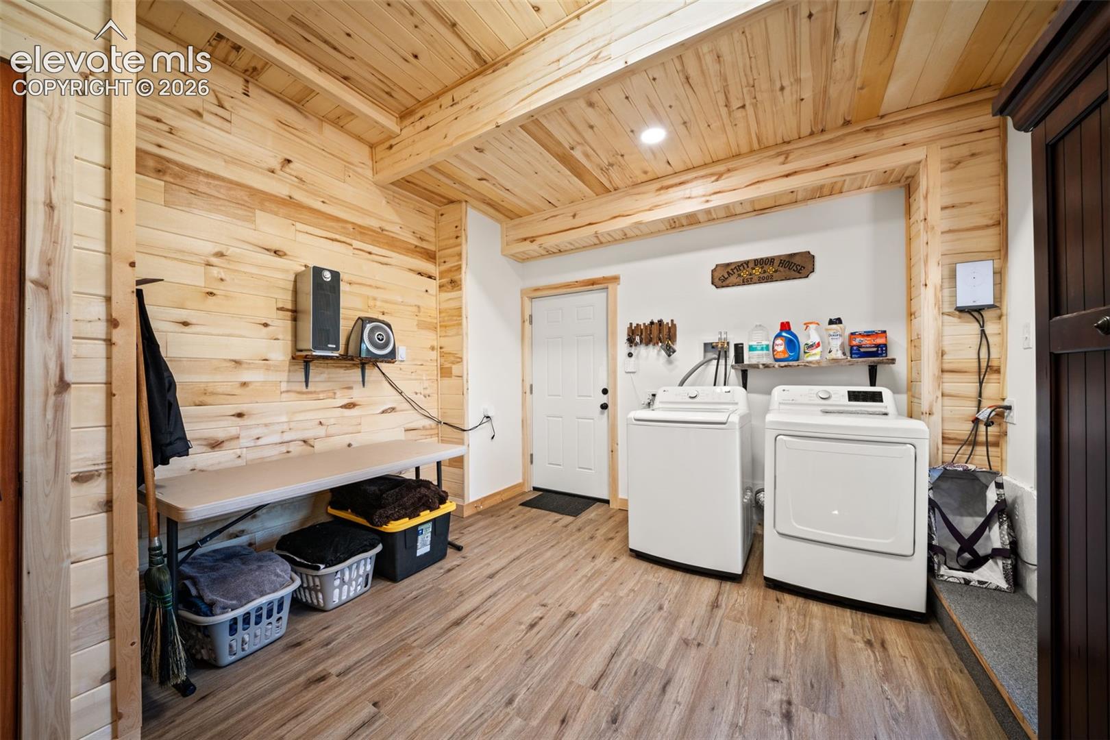 Basement level laundry room. mechanical room and storage