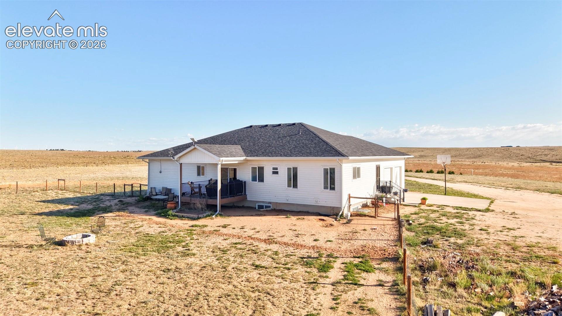 Back of house with covered front porch