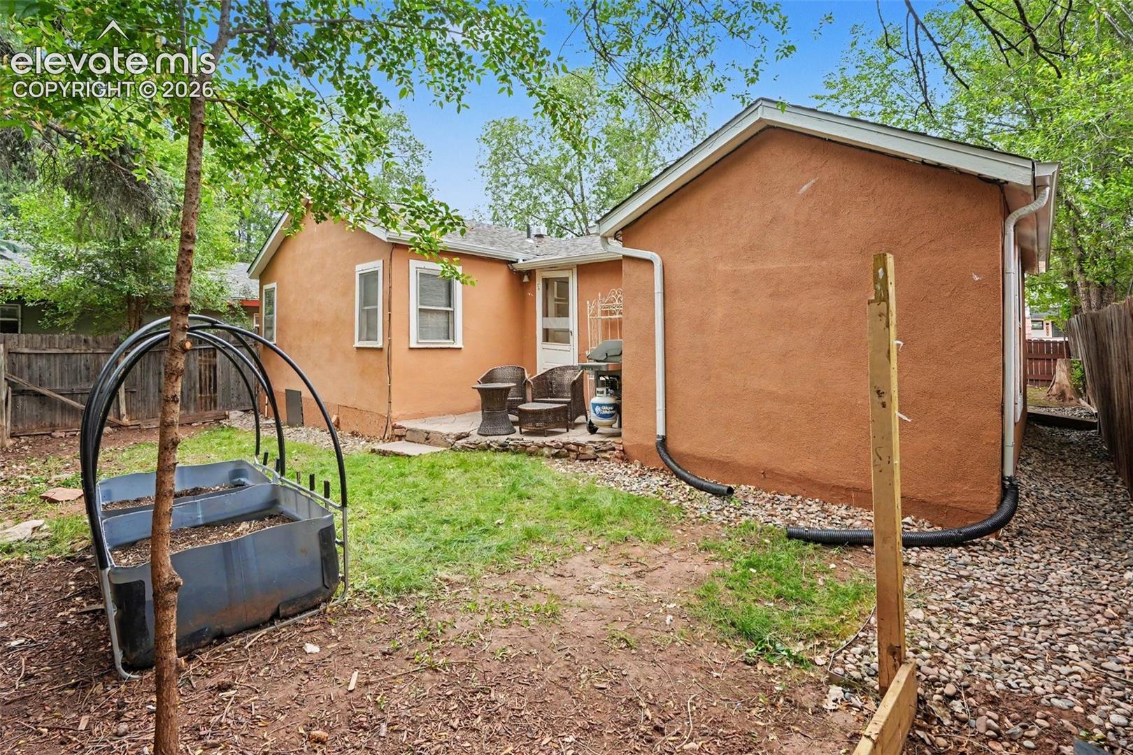 Enjoy square foot gardening and a patio to grill on.