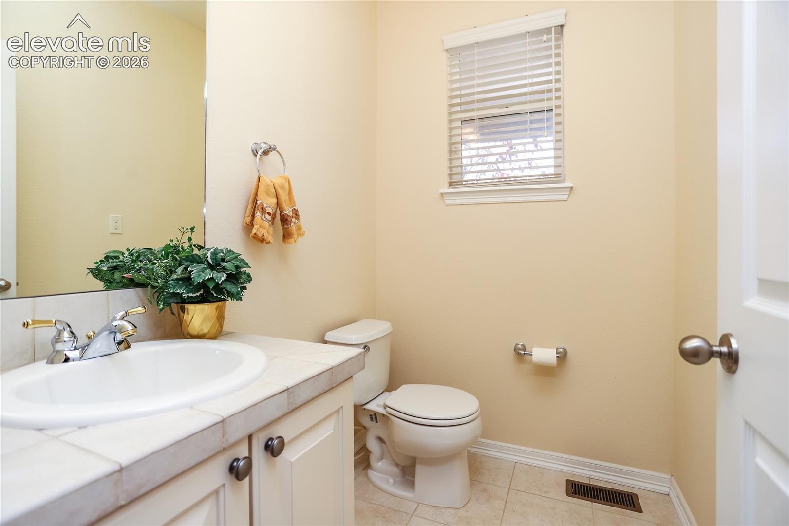 Powder room is located by the foyer.