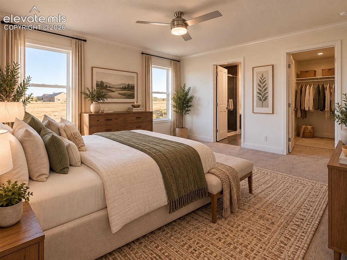 Primary Bedroom – Alternate view highlights the primary suite’s comfortable proportions, multiple windows, direct bathroom access, and walk-in closet.