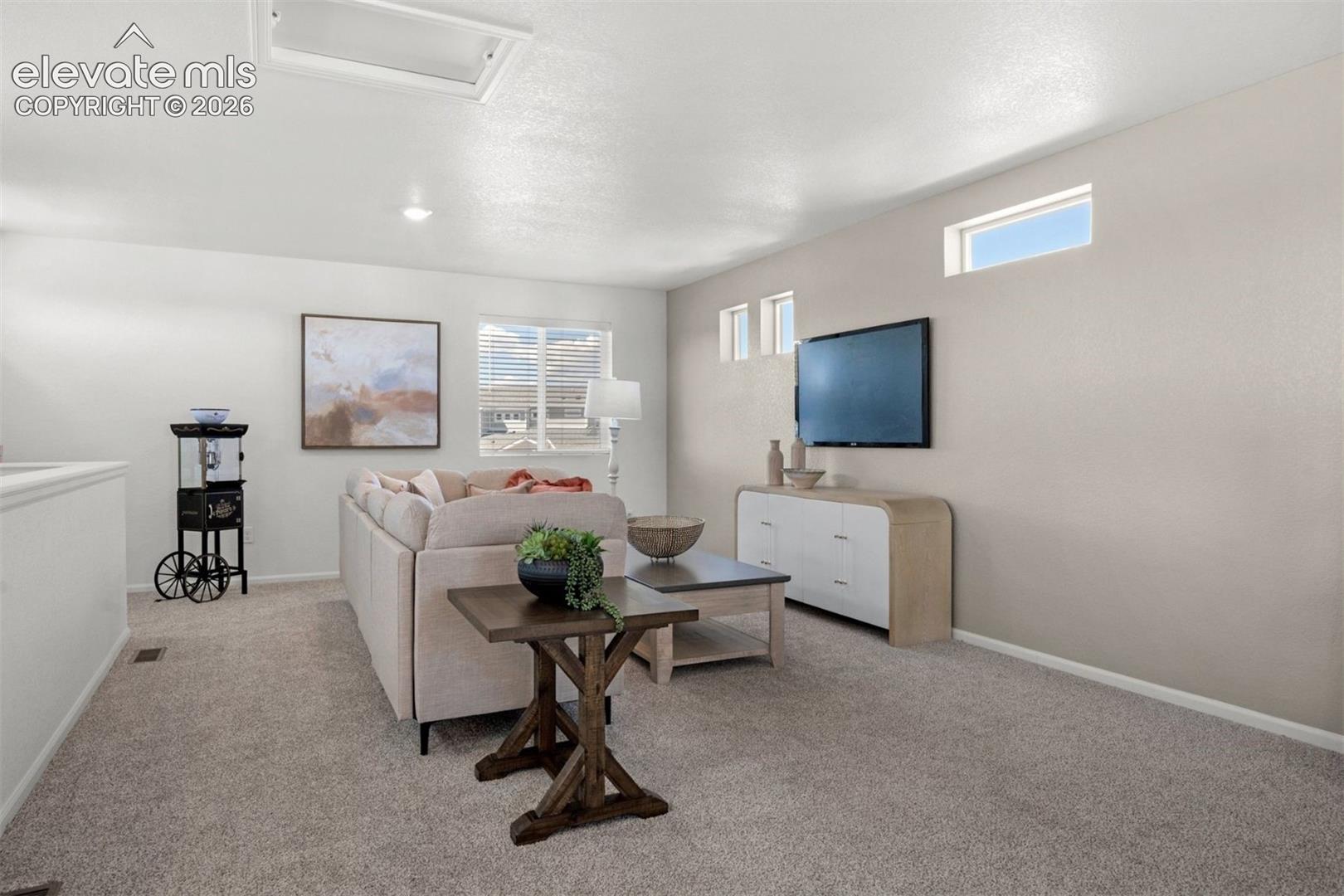 Recessed lighting, light-toned carpeting, transom window, rectangular window, light-toned wall paint
*photos of a model home*