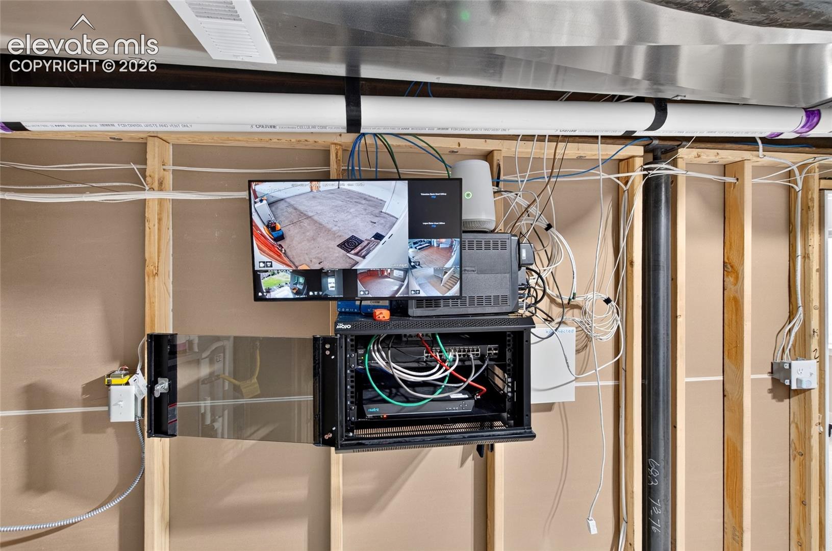 View of professional grade Reolink camera system featuring 4 interior and 4 exterior cameras linked with Ring system